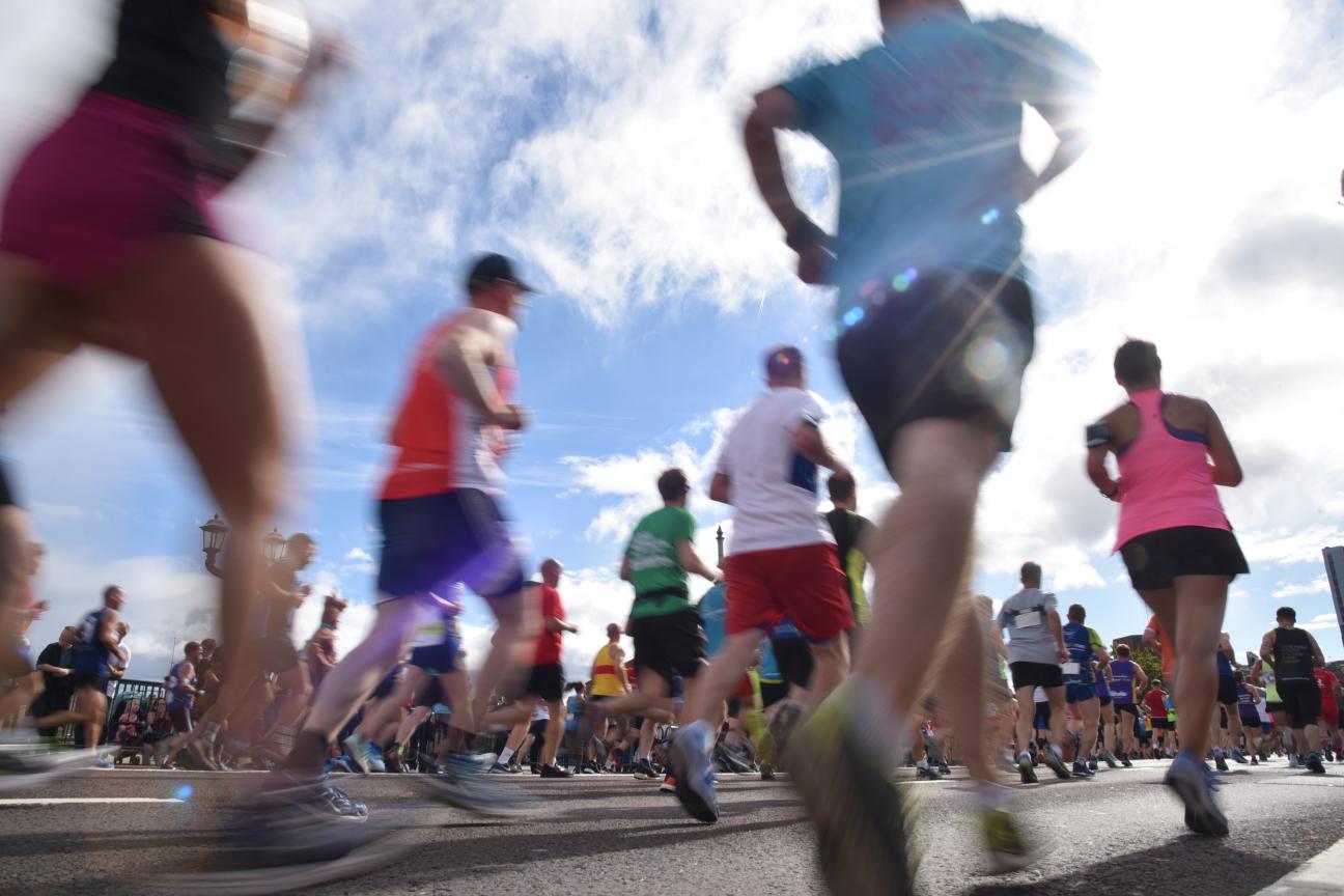 Image of people running past quickly