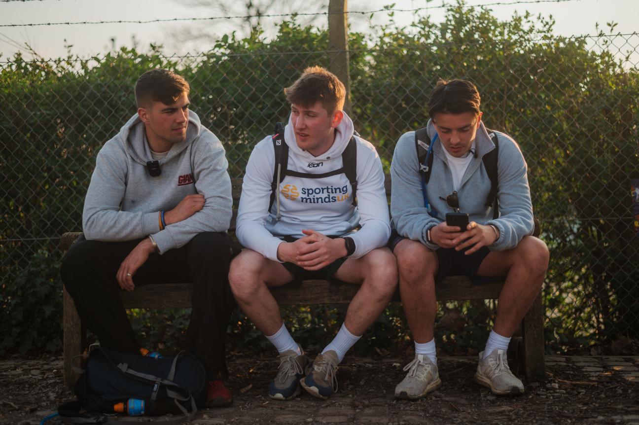 Photo of Ben sitting with his friends