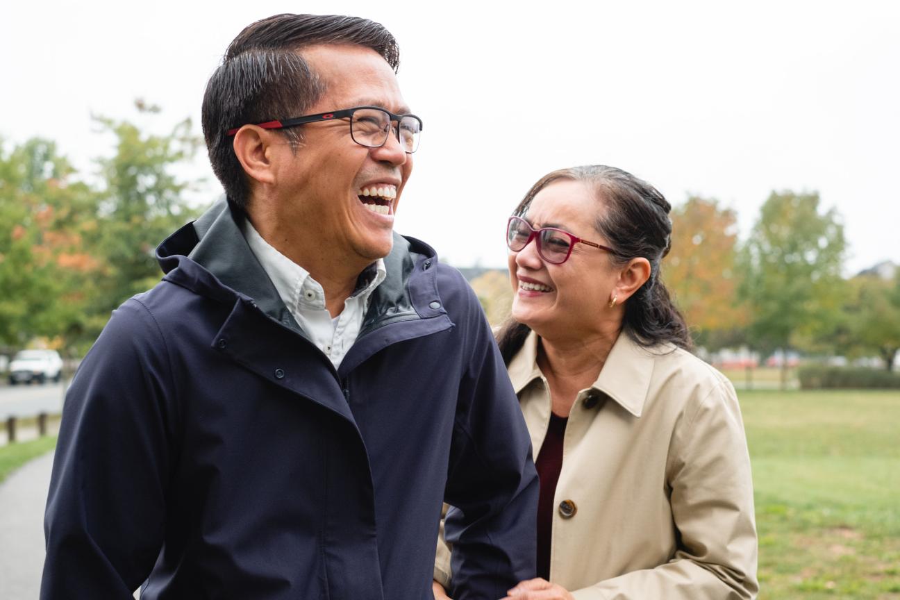 Couple laughing in a park