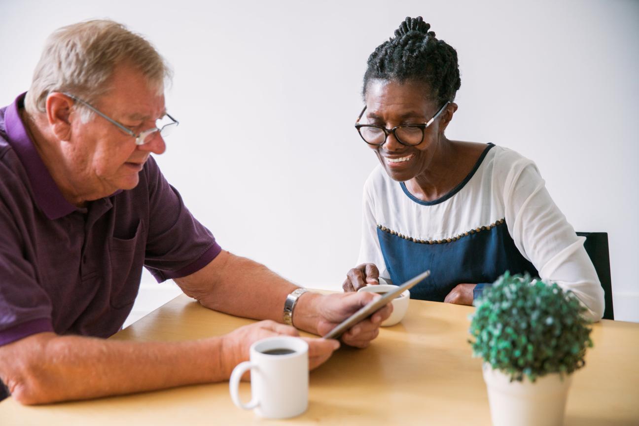 Older man and woman using technology