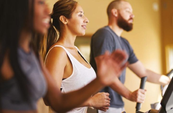 People exercising on cardio machines