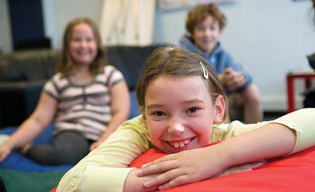 Girl smiling in a room