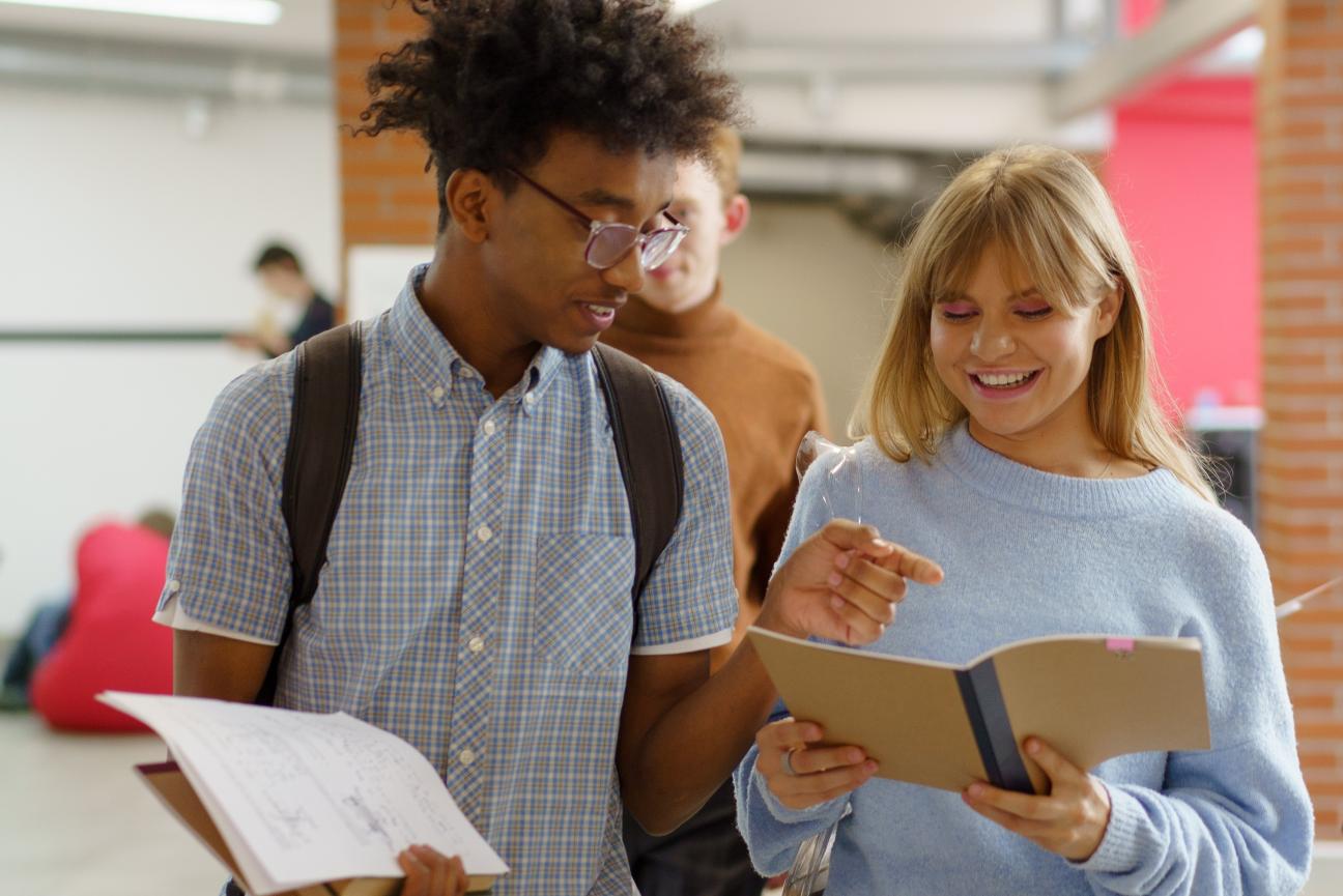 Young people walking with school books