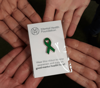 Green ribbon pin badge