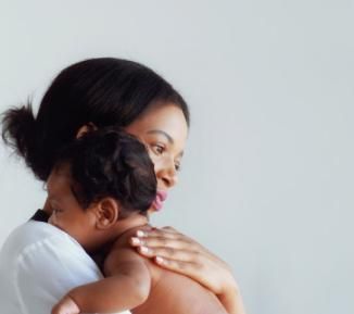 Photo of a mother holding her baby