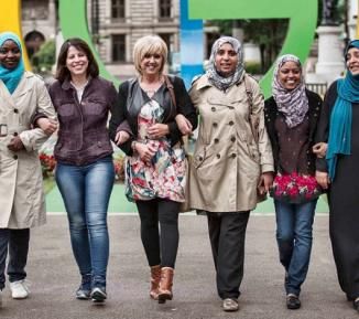 Women smiling in a line