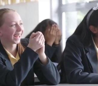 Two School Girls Laughing