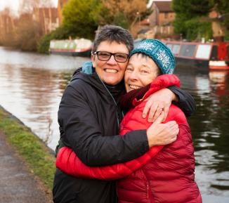 Older couple outside on the river