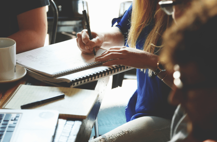 Students writing and studying