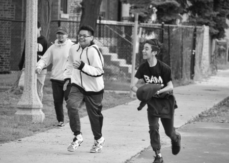 Kids from the Becoming a Man (BAM) project running and playing