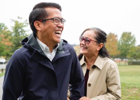 Couple laughing in a park