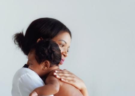 Photo of a mother holding her baby