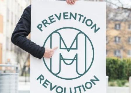 Man holding MHF prevention sign