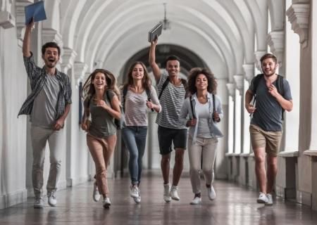 Students celebrating with hands in the air