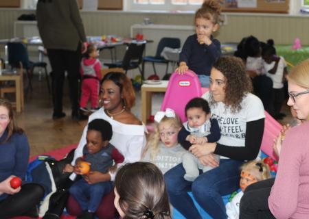 Young mums and babies in a room