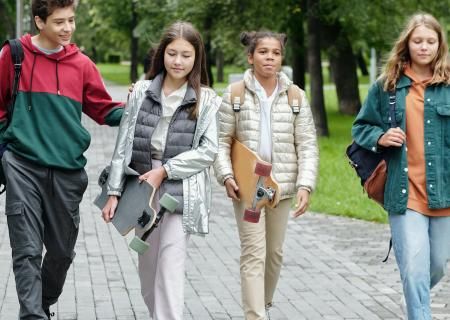 Children walking and smiling in a line