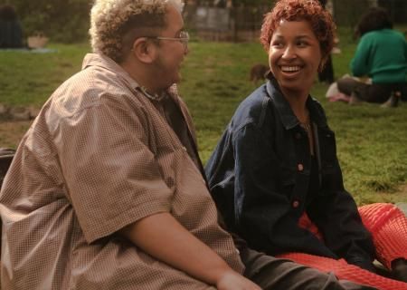 A trans couple at a picnic in the park