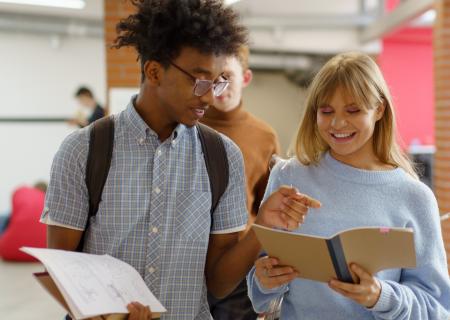 Young people walking with school books